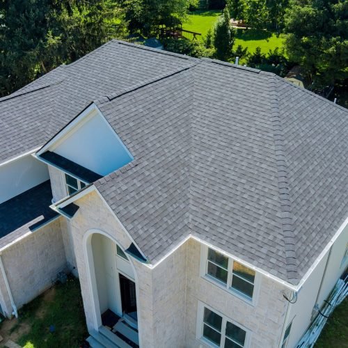 aerial-view-asphalt-shingles-roofing-construction-house-with-new-window-scaled.jpg
