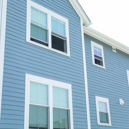 blue-house-with-blue-house-with-window-that-says-no-one