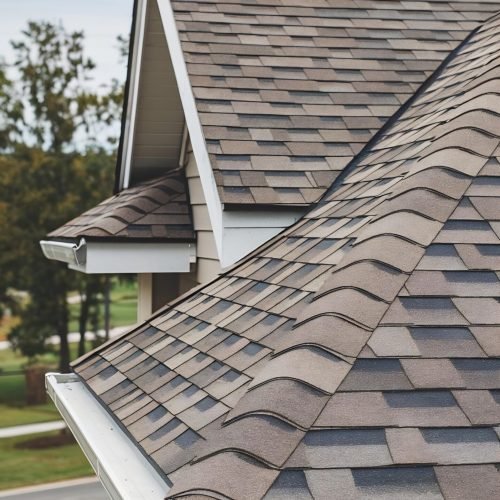 closeup-new-house-roof-with-shingles-gutters-place
