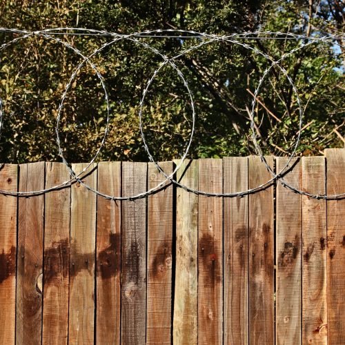 A closeup shot of a wooden fence with circles above