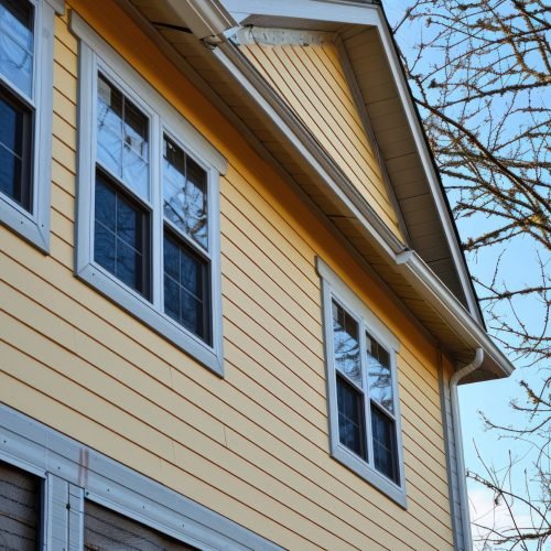siding covering the wall of a house under construction: siding,house,home,repair,construction,wall,work,exterior,plastic,decoration --ar 3:2 --v 6 Job ID: 811f5774-57a3-491a-ac79-481fb2595104