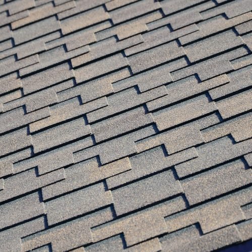 Modern roofing and decoration of chimneys. Flexible bitumen or slate shingles in rectangular shape in perspective.