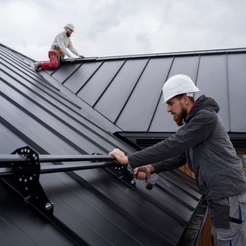 medium-shot-men-working-roof-together-scaled.jpg